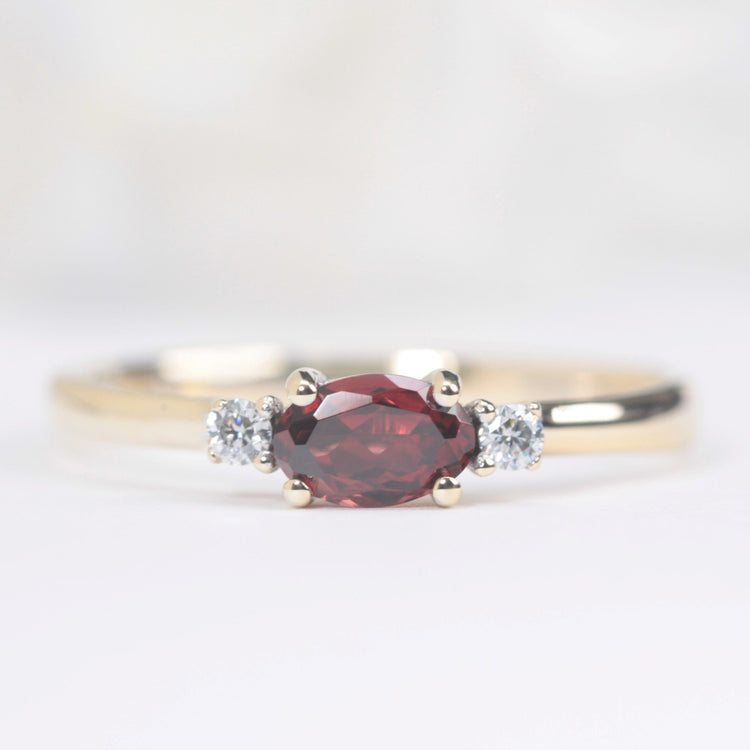 garnet and diamond engagement ring in yellow gold