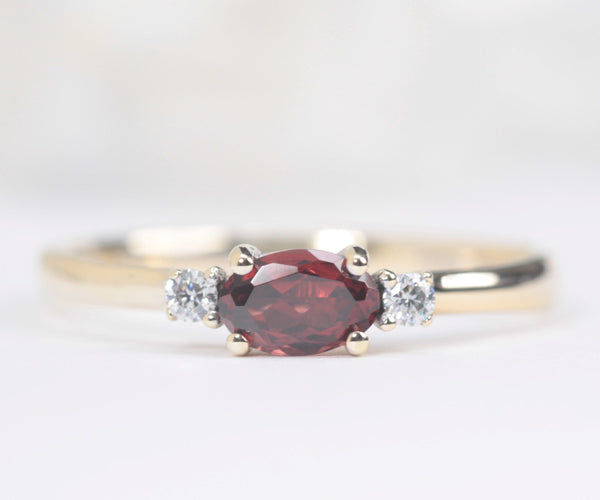 garnet and diamond engagement ring in yellow gold