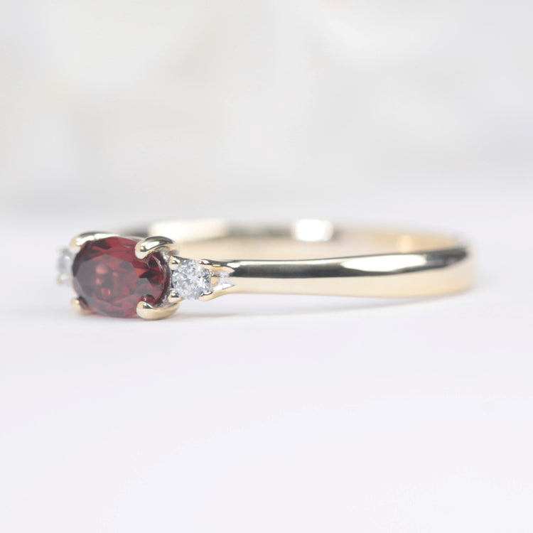 garnet and diamond engagement ring in yellow gold