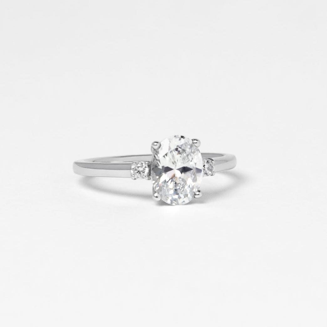 oval moissanite trilogy engagement ring white gold