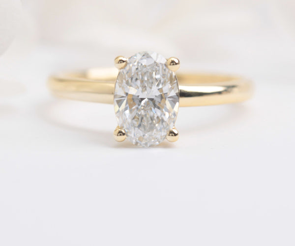 oval solitaire lab diamond engagement ring yellow gold