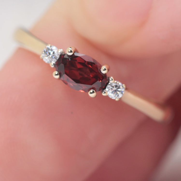 garnet and diamond engagement ring in yellow gold