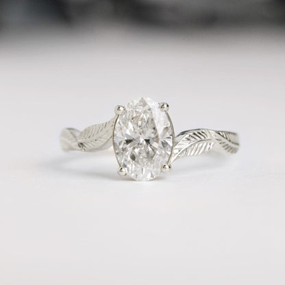 oval diamond leaf engagement ring white gold front