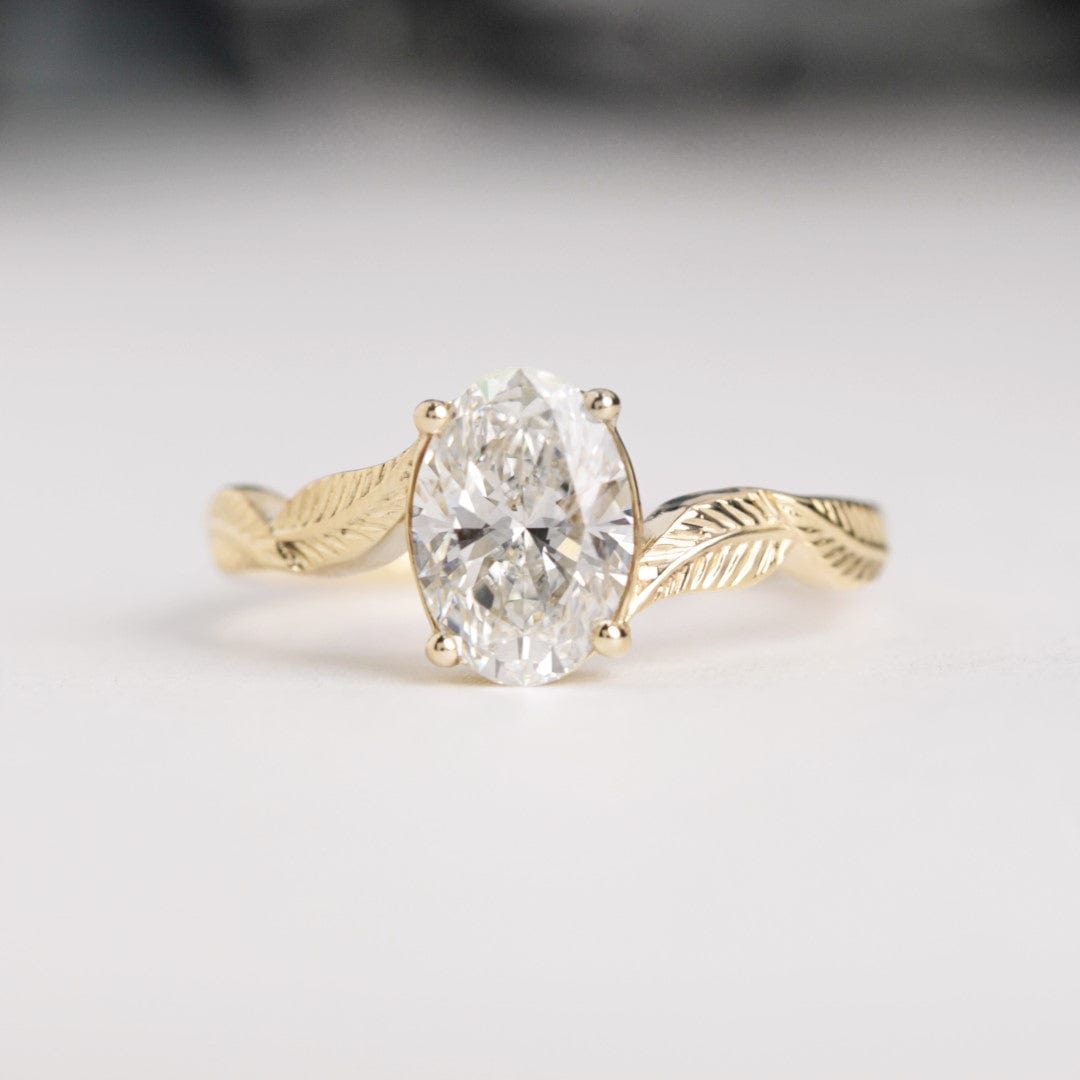 oval diamond leaf engagement ring yellow gold front