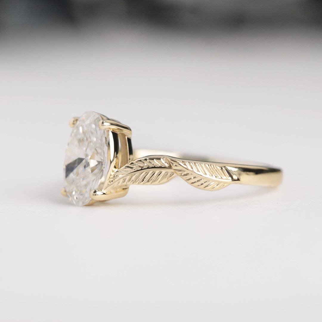 oval diamond leaf engagement ring yellow gold front